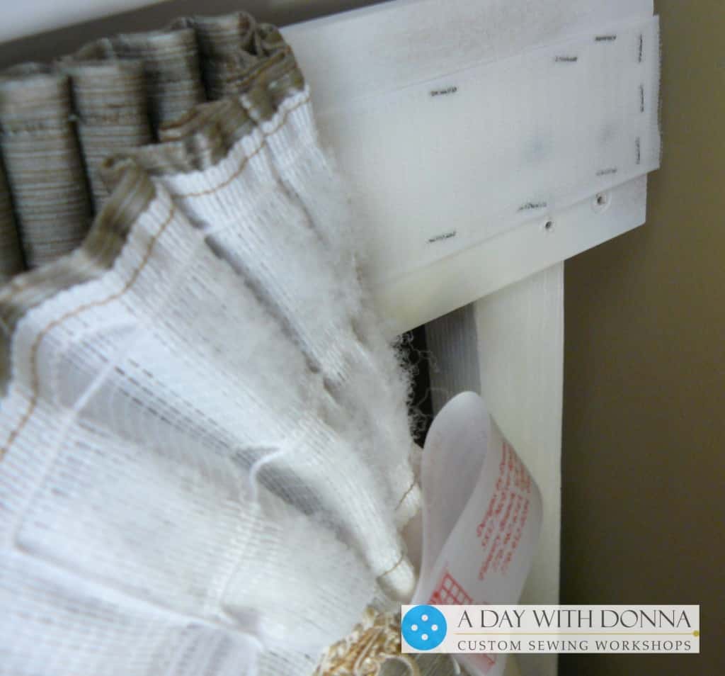 This picture shows you the hook portion of the Velro stapled to the frame and the back side of the skirt with the pencil pleat shirring loop tape.
