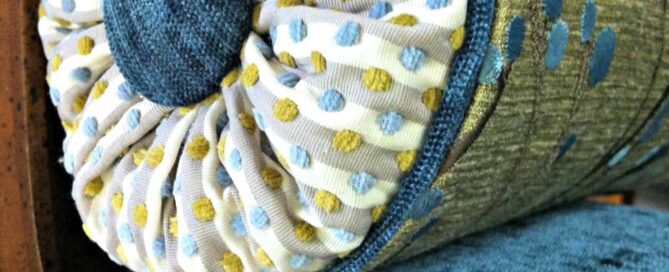 A pool noodle inside the pillow makes for easy insertion of the button twine into the pillow.