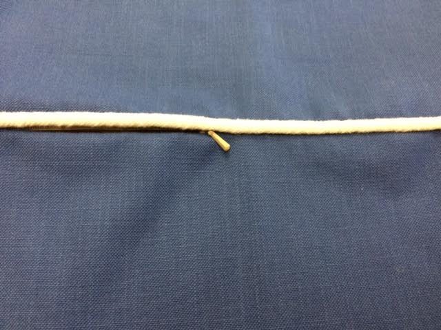 When inserted correctly, only the zipper pull shows.