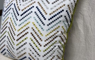 In pillow making, pillows with the 'dog ears' removed will create a pillow with tapered corners, but still with an overall square appearance.
