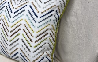 Pillows cut and sewn as squares will have pointy corners. See that little crease towards the lower right hand side of the pillow? I think this bothers some people so they like to taper the corners.