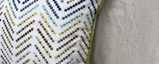 Pillows cut and sewn as squares will have pointy corners. See that little crease towards the lower right hand side of the pillow? I think this bothers some people so they like to taper the corners.