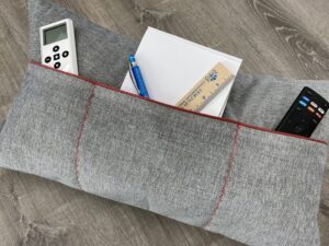 Keep everything in it's place with a pocket pillow with sections.
