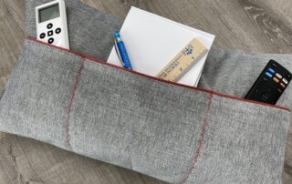 Keep everything in it's place with a pocket pillow with sections.
