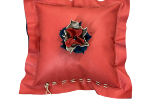 leather flanged pillow with a flower