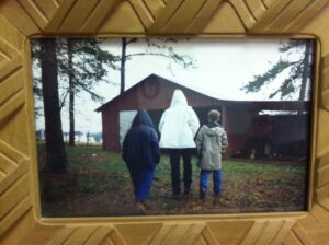 Greg, Justin, and Christopher looking at the barn.